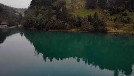 Tranquil-Scenery-Of-Lake-With-Beautiful-Reflections-In-Kaprun,-Austria---aerial-drone-shot