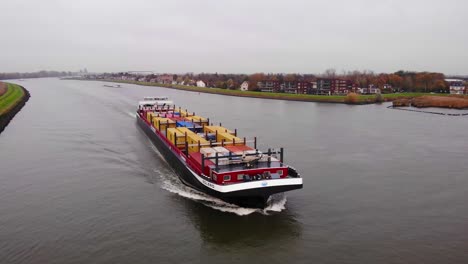 Aerial-View-Of-Bolero-Cargo-Ship-On-River-Noord-Near-Hendrik-Ido-Ambacht