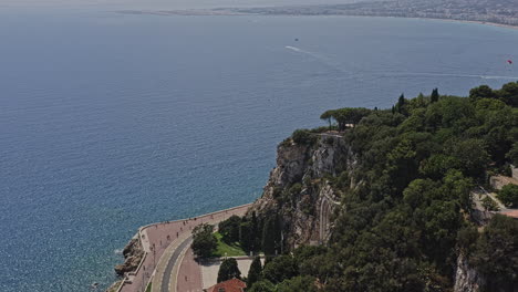 Nice-France-Aerial-v17-drone-fly-around-castle-hill,-reveals-famous-historical-war-memorial-rauba-capeu-and-coastal-view---July-2021