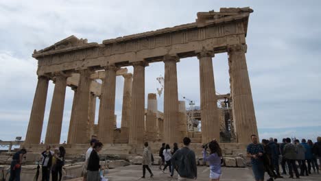 Parthenon-temple-with-tourist-around-on-the-Acropolis-in-Athens,-Greece-on-10-15-2021