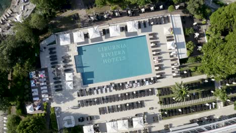 Top-View-Of-The-Swimming-Pool-Of-Hotel-Ambassador-During-Summer-Day-In-Opatija-City,-Croatia