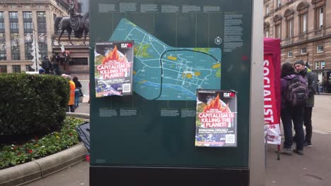 Two-climate-change-leaflets-on-a-public-city-map