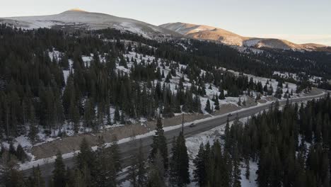 Aerial-flight-following-the-traffic-of-Highway-9-at-sunset-with-Mt
