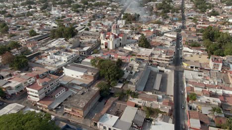 Aerial-View-Of-City-Of-Colima-In-Mexico-With-Parish-Of-The-Blood-Of-Christ-Revealed