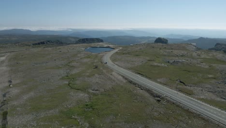Isolated-car-driving-on-road-at-Serra-da-Estrela,-Portugal