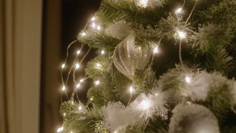 Christmas-ornament-on-a-beautiful-Christmas-tree,-parallax-in-slow-motion