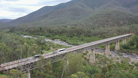 Aerial-of-expedition-vehicles-crossing-McKillops-Bridge-on-Snowy-River