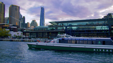 RiverCat-Boat-Sailing-At-Port-Jackson-With-Sydney-CBD-Skyline-From-Ferry-Boat-In-NSW,-Australia