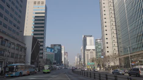 Seoul-centre-skyline-with-many-skyscrapers-from-the-middle-of-Gangnam-daero-main-road-on-a-sunny-day