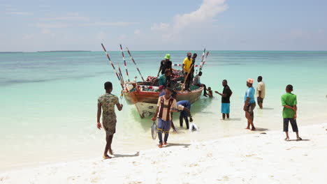 Fishermen,-fishing-boat-on-the-beach,-Nungwi,-Zanzibar,-Tanzania,-slow-motion