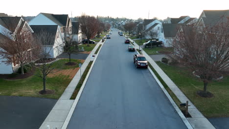Low-aerial-through-residential-neighborhood-in-USA