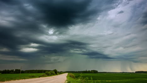 Time-lapse-shot-of-dark-grey-clouds-covering-agricultural-field-in-nature