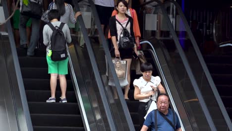 Slow-motion-clip-of-crowd-people-who-don't-wear-surgical-mask-in-escalator-in-Hong-Kong
