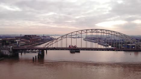 Aerial-View-Of-Brug-Over-De-Noord-With-Excelsior-Cargo-Ship-Approaching-In-Distance