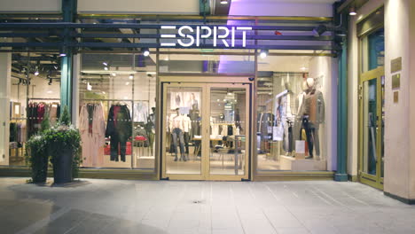 Static-slomo-of-people-with-face-masks-walking-outside-Esprit-store