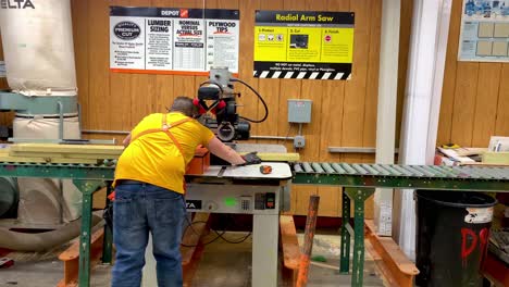 Worker-working-on-Table-Saw-Cutting-Wood-inside-Home-Depot-Store