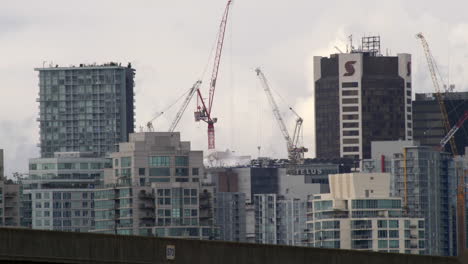 Static-shot-of-buildings-with-construction-cranes