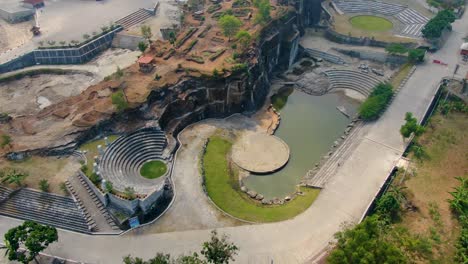 Outdoor-amphitheater-and-pond-by-Breksi-Cliff-in-Yogyakarta,-Indonesia