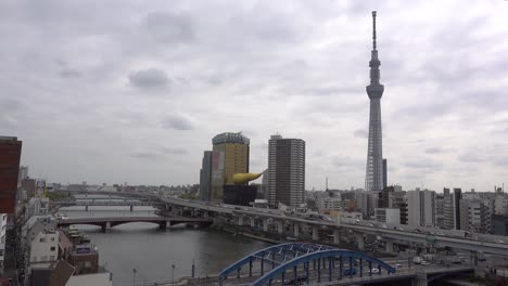 Heavy-traffic-in-Tokyo-city-on-cloudy-day,-looking-out-from-high-above