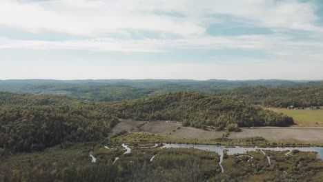 Gorgeous-4k-drone-film-of-the-Gatineau-hills-on-a-beautiful-cloudy-and-sunny-day-in-at-Wakefield,-Quebec,-Canada