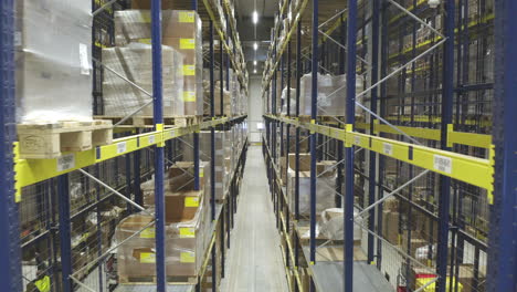 Aerial-Shot-Of-Packages-Stored-Inside-A-Parcel-Distribution-Warehouse,-International-Courier-Industry