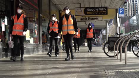 Cleaners-sanitise-quiet-Australian-streets-during-the-coronavirus-lockdown---shot-in-Melbourne