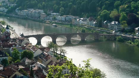 Heidelberg-medieval-bridge-over-neckar-Alte-Brücke-famous-landmark-moving-water