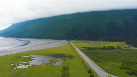 4K-Cinematic-Drone-Video-of-Mountains-Surrounding-Turnagain-Arm-Bay-Looking-Over-Seward-Highway-Alaska-Route-1-at-Glacier-Creek-Near-Anchorage,-AK