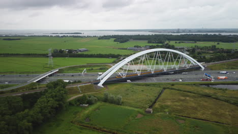 Aerial-view-of-Koploper-train-on-zandhazenbrug-in-the-direction-of-Weesp