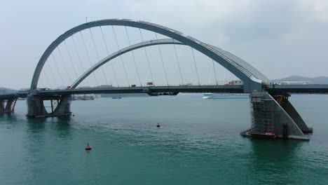 Hong-Kong-cross-bay-link-construction-project,-a-dual-two-lane-bridge-connecting-Tseung-Kwan-O-Lam-Tin-Tunnel-to-Wan-Po-Road,-Aerial-view