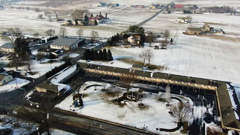 AERIAL-Heavy-Snow-Falling-Over-Country-Town-Motel