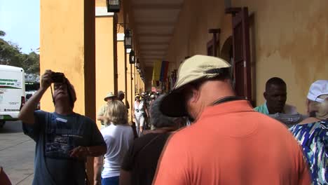 Tourists-at-historical-landmark-Las-Bovedas-Market-in-the-Old-City-of-Cartagena-in-Colombia