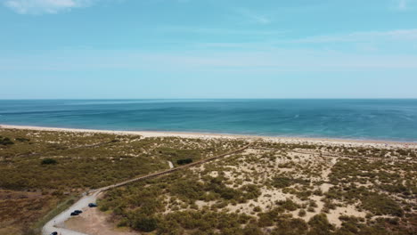 Strahlend-Blauer-Altura-Strand-In-Portugal-An-Einem-Sonnigen-Tag---Luftaufnahme
