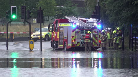 Firefighters-prepare-a-fire-engine-to-pump-water-out-from-a-flooded-road-following-thunderstorms-that-saw-more-than-a-month’s-worth-of-torrential-rain-fall-in-several-hours-across-the-capital