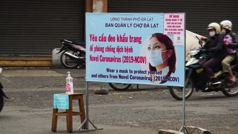 Disinfectant-liquid-and-information-signboard-during-Covid19-pandemic,-Vietnam