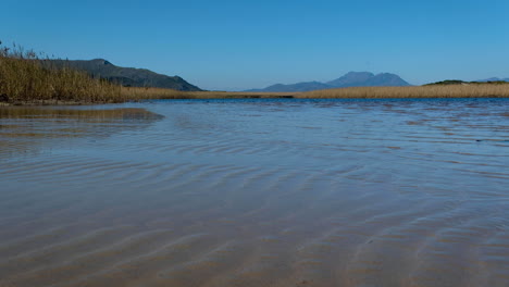 High-tide-pushing-water-into-lagoon,-beautiful-nature,-Kleinmond,-South-Africa