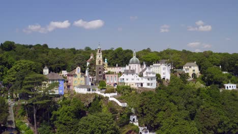 Drone-making-flypast-along-the-Dwyryd-Estuary-and-focusing-on-the-village-of-Portmeirion,-which-is-a-major-tourist-attraction-of-North-Wales-in-the-UK