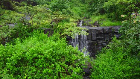 Drone-Shot-of-Beautiful-Waterfall-on-the-hill