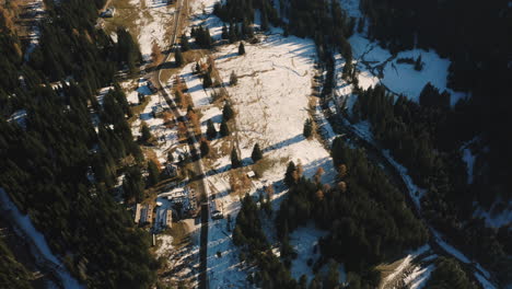 Drone-rotates-high-above-a-snow-covered-Paneveggio-Park