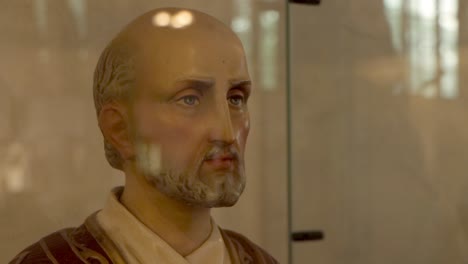 Statue-of-St.-Ignatius-of-Loyola-behind-glass