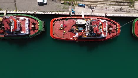 Top-View-Of-Colorful-Tugboats-Docked-At-The-Port-Of-Ploce-In-Croatia