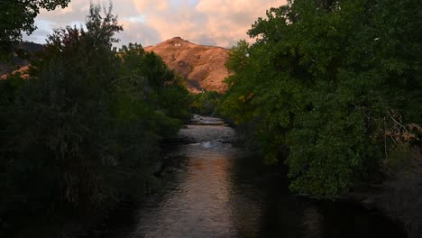 Water-flowing-down-Clear-Creek-in-Golden-Colorado-during-the-day-with-the-Colorado-School-of-Mines-M-in-the-background