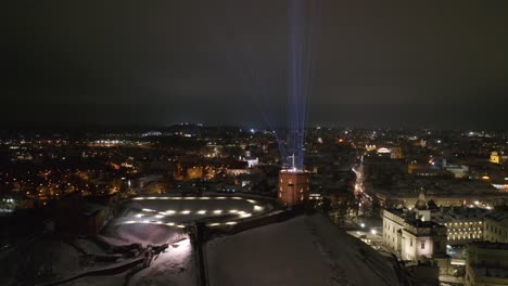 Vilnius-Gediminas-Tower-with-Lasers-Beams-Futuristic-Neons-into-the-Sky-on-Late-Winter-Evening