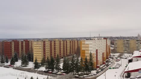 Drone-shot-paning-towards-old-soviet-architecture-9-floor-houses-in-Kivilinn-next-to-gas-station