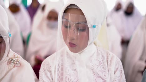 West-Java-Indonesia-January-2,-2022-:-Beautiful-women-in-hijabs-wearing-face-shields-during-the-pandemic