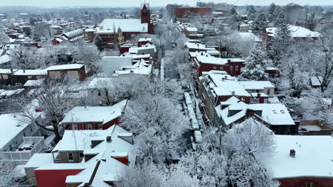 Aerial-reveal-above-street-during-winter-snow