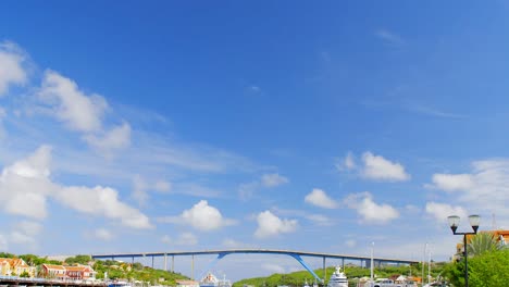 Beautiful-waterfront-alongside-Saint-Anna-Bay-and-the-Queen-Juliana-Bridge-in-Punda,-Willemstad,-on-the-Caribbean-island-of-Curacao