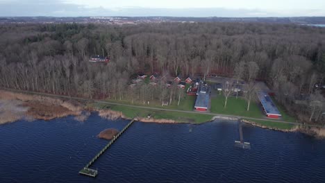 Aerial-Flyover,-Small-Harbor-in-Lake-with-Beautiful-Surroundings---Dolly-In-Shot-and-Tilt-Down-Shot