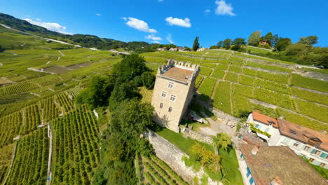 Drone-Flight-Towards-Tour-de-Marsens-In-Epesses-Village-Surrounded-By-Terraced-Vineyards-Of-Lavaux-In-Vaud,-Switzerland