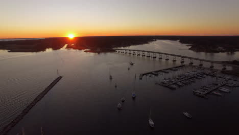 Aerial-Drone-Flyover-of-Oriental-NC-Harbor-and-marina-at-sunset-orbiting-clockwise-facing-south